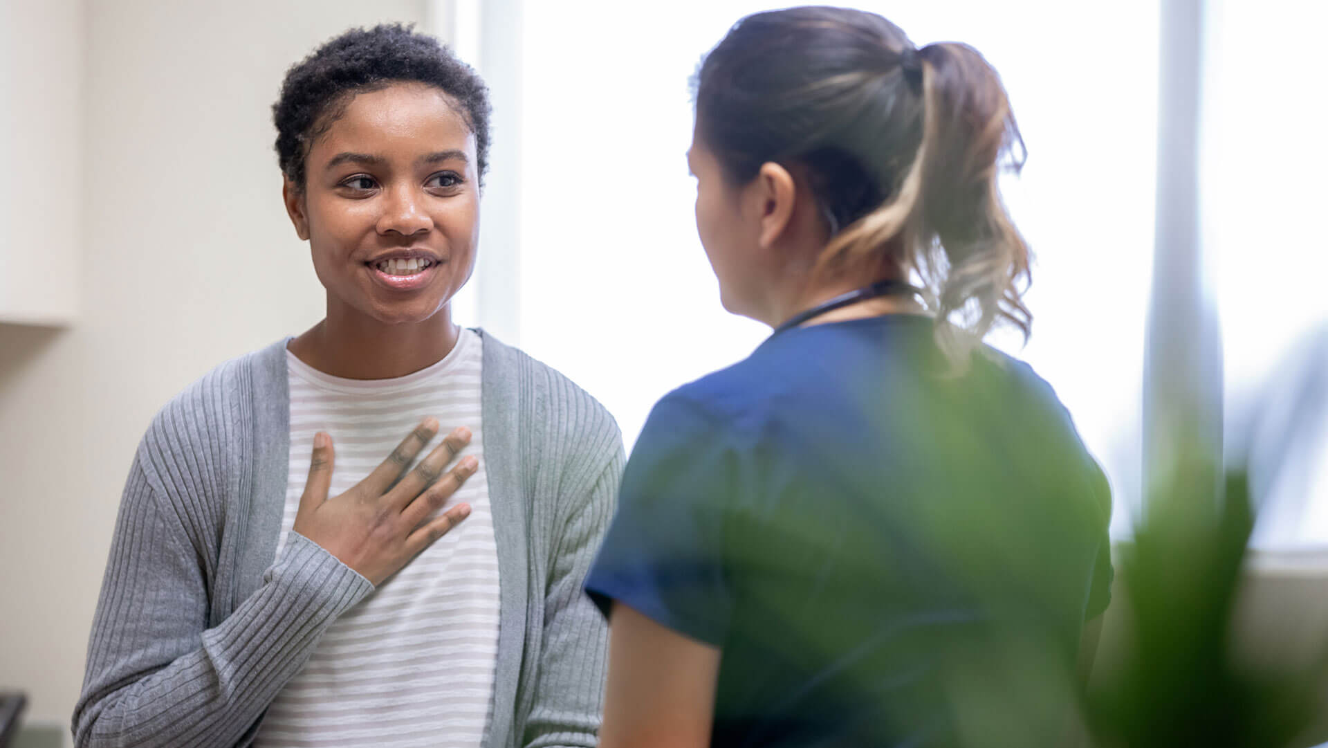 a young woman consults her physician