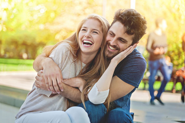 a happy young couple embrace