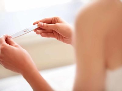 Woman Holding Pregnancy Test