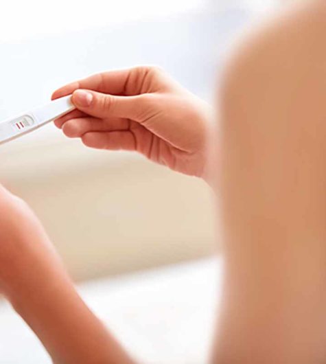 Woman Holding Pregnancy Test