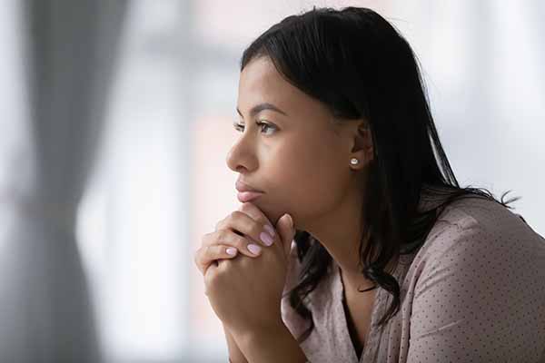 Thoughtful African American young woman look in distance pondering or remembering, pensive biracial millennial female lost in thoughts feel stressed troubled, thinking of problem solution